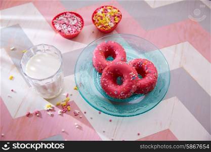 Kids party with milk pink donas and cupcake toppings as breakfast