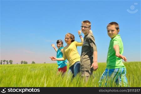 kids play in wheat field