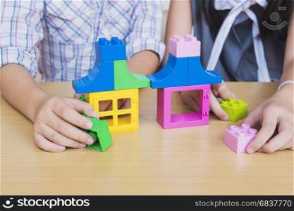 Kids playing pieces plastic creative construction blocks