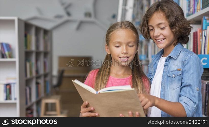 kids reading from book with copy space