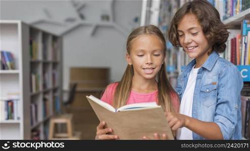 kids reading from book with copy space