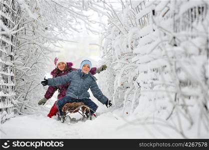 Kids sliding in winter time