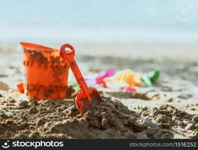 kids toys on sandy beach