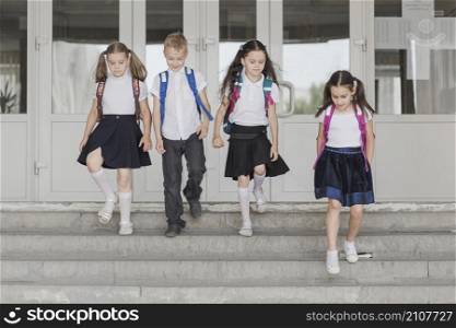 kids walking down school steps