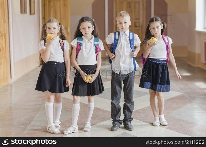 kids with apples standing school corridor