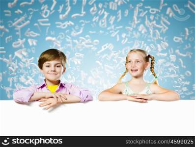Kids with banner. Image of cute kids holding blank white banner. Place for text