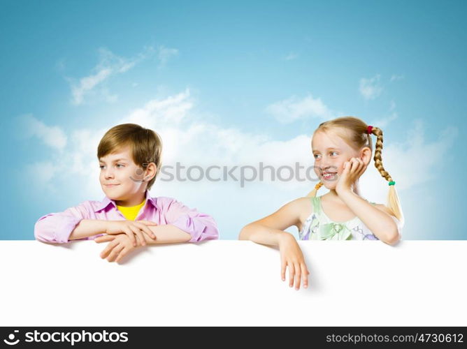 Kids with banner. Image of cute kids holding blank white banner. Place for text