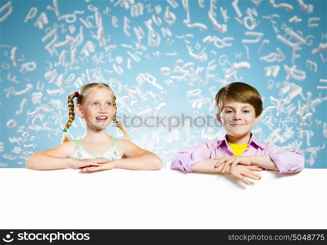 Kids with banner. Image of cute kids holding blank white banner. Place for text