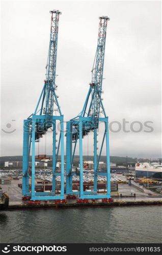 Kiel,Germany,03-08-2017: Big cranes and container terminal in Kiel : Kiel is the biggest container terminal and harbor in North Germany. harbor Kiel germany