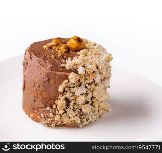 Kiev cake with walnuts on white plate