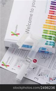 Kiev, Ukraine - 17 October 2018  23andMe new personal ancestry genetic test saliva collection kit, tube, box and instructions. Illustrative editorial.