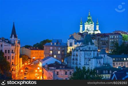 Kiev, Ukraine. Beautiful night view of the ancient street Andrew&#39;s Descent and the St. Andrew&#39;s Church from the Castle Hill in Kyiv
