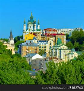 Kiev, Ukraine. Beautiful view of the St. Andrew&#39;s Church on the Andrew&#39;s Descent among green trees of the Castle Hill in Kyiv