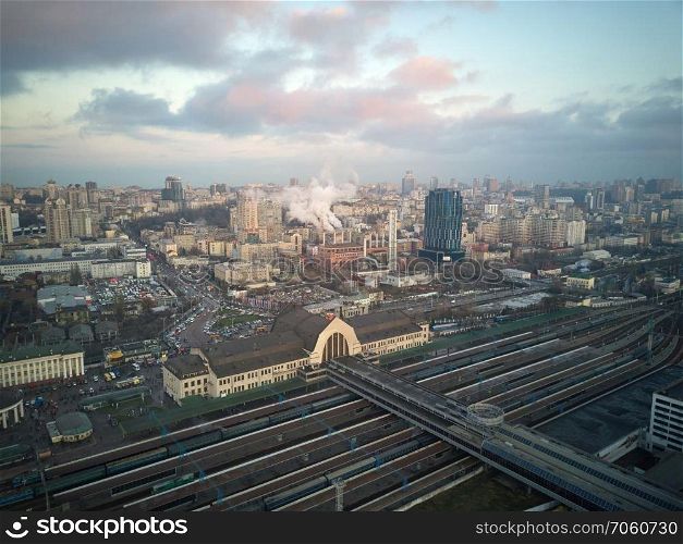 Kiev, Ukraine.- January 11,2018: Aerial view of the city of Kiev, view of the station and railroad tracks, blue sky with gray clouds. Aerial view of the city of Kiev