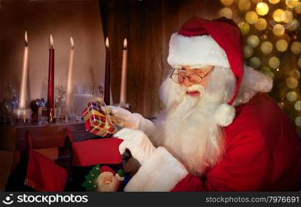 Kind Santa Claus winks a Christmas Present to the Christmas Stocking.