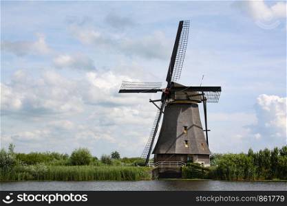 Kinderdijk mill near Rotterdam is an antique wind pump at the waterway