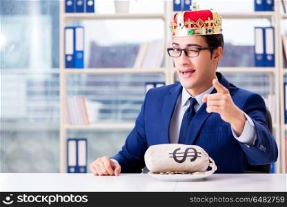 King businessman with money sack in office