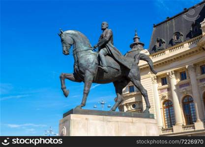 King Carol I statue and National Library in Bucharest, Romania in a beautiful summer day