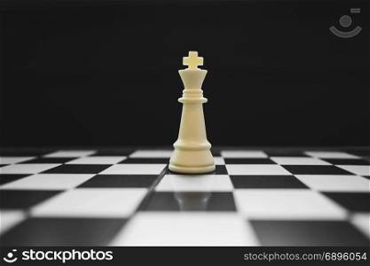 king of the winner on chess board game, competition and strategy concept