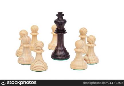 King surrounded by pawns. Wooden chess piece on chessboard