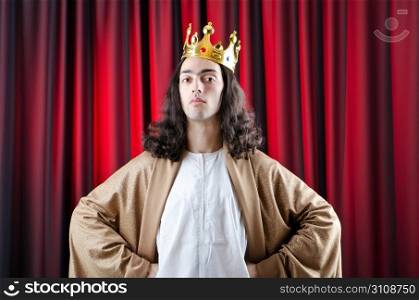 King with crown against background