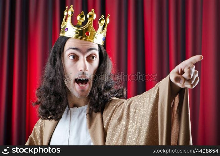 King with crown against background