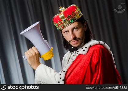 King with loudspeaker in funny concept