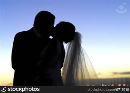 Kissing bride and groom
