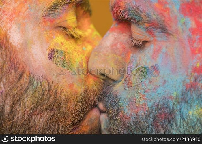 kissing couple rainbow painted homosexual men