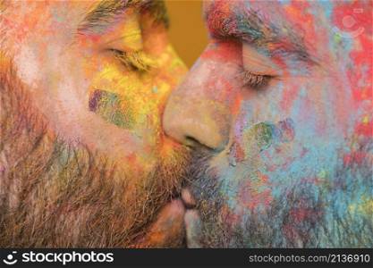 kissing couple rainbow painted homosexual men