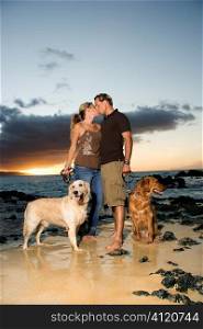Kissing Couple With Dogs at the Beach
