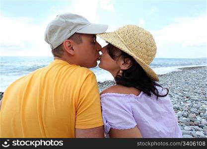 kissing pair on beach