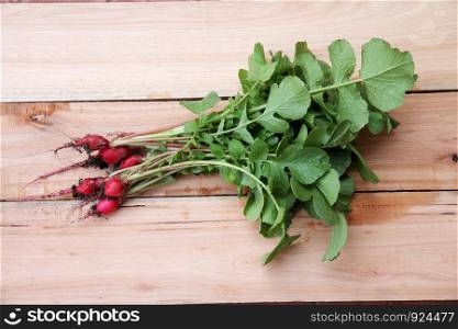 kitchen background with radishes on wooden background