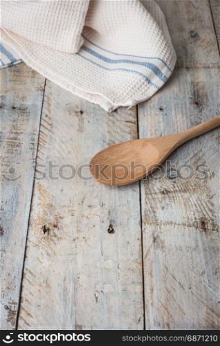 Kitchen background with towel and cooking tools top view copy space.