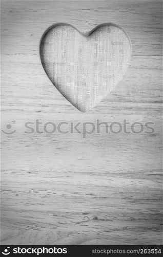 Kitchen board with heart shape as border frame background with space for text menu on wooden surface, empty blank sign