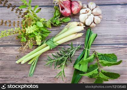 kitchen herb garden concept / Natural fresh herbs and spice on rustic wood background in the kitchen for ingredient food