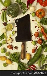 Kitchen knife and organic vegetables. Top view. Kitchen knife and organic vegetables