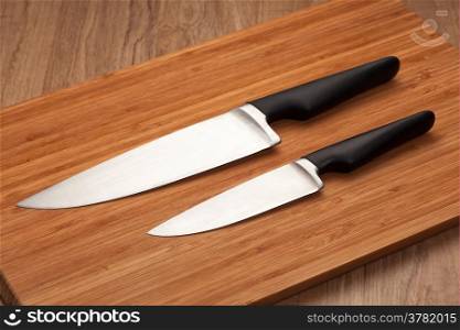 Kitchen knives on wood cutting board