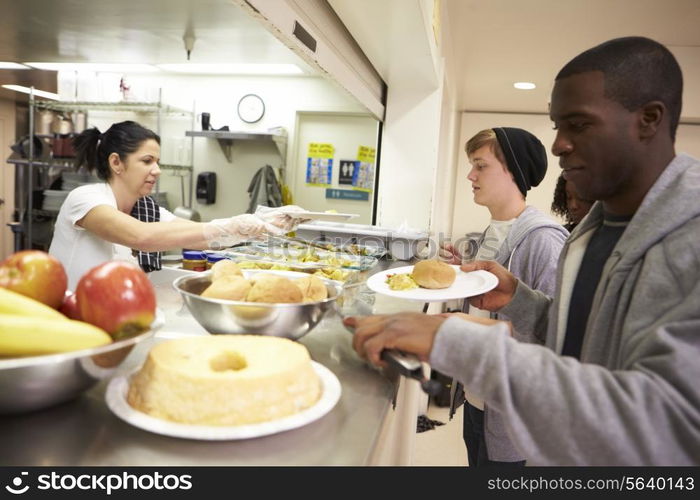 Kitchen Serving Food In Homeless Shelter