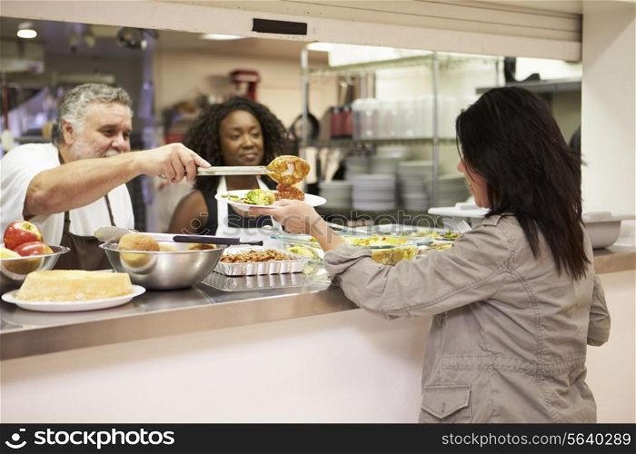 Kitchen Serving Food In Homeless Shelter