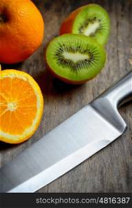 Kitchen stainless knife detail and fruits