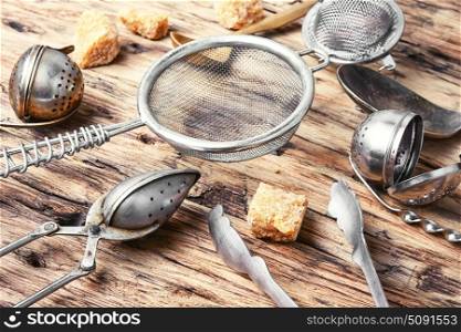 kitchen utensil for tea-drinking. kitchen utensil, tea-spoons, scalded spoons on a wooden background