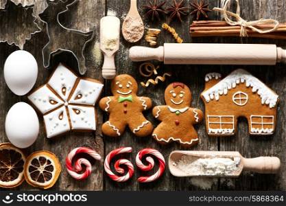 Kitchen utensils and ingredients for christmas homemade gingerbread cookies on wooden table