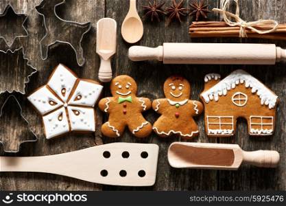 Kitchen utensils for christmas homemade gingerbread cookies on wooden table