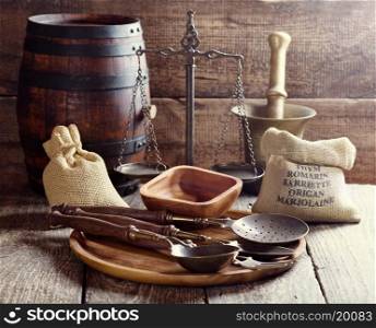 kitchen utensils on rustic wooden background