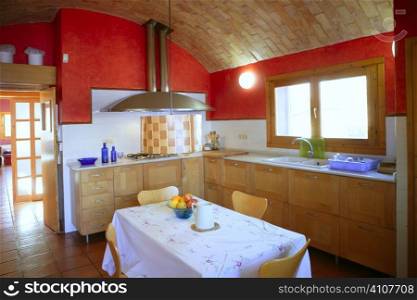 Kitchen with barrelt vault ceeling, red wall in mediterranean style