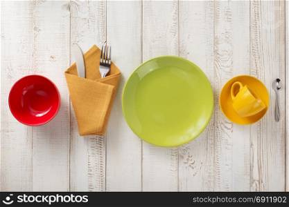 kitchenware and crockery at white wooden background