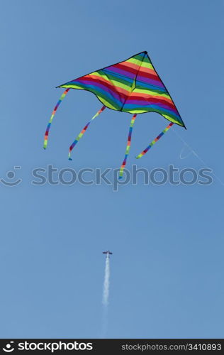 Kite in the foreground and aircraft. Vertical image