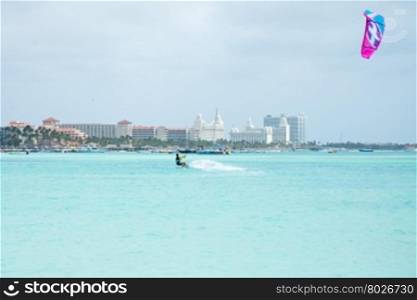 Kite surfer on Palm Beach at Aruba island in the Caribbean