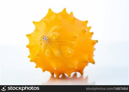 Kiwano or horned melon isolated on white background with copy space for your text. Cucumber theme.. Kiwano or horned melon isolated on white background with copy space for your text.